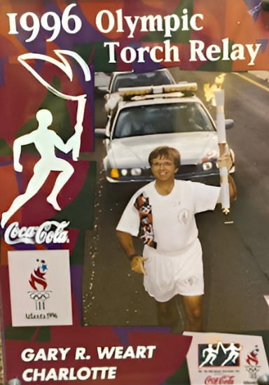 Gary running with the Olympic Torch